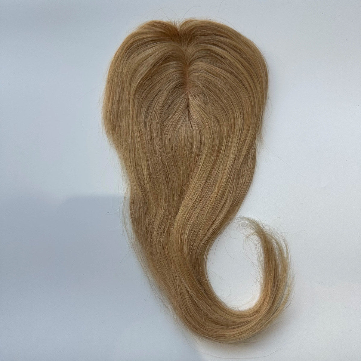 Straight human hair topper in colour 18, product top view