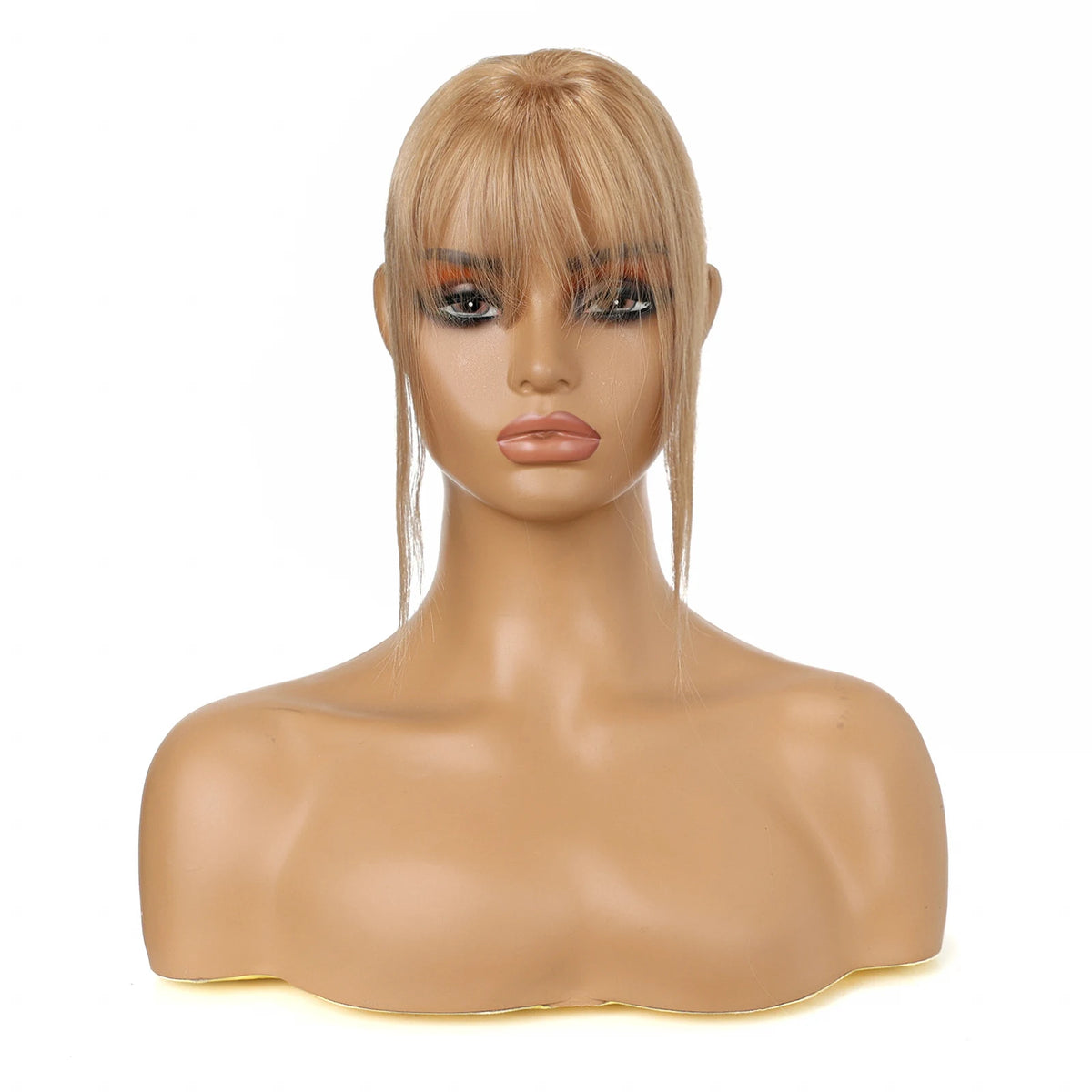 Warm champagne blonde fringe and side strands displayed on a mannequin