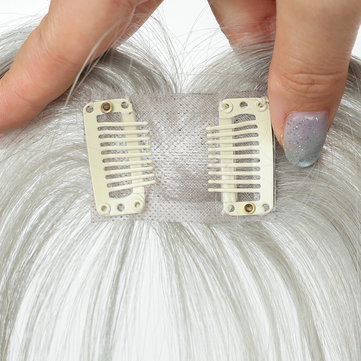 Light silver grey fringe hairpiece underside showing the base and two clips