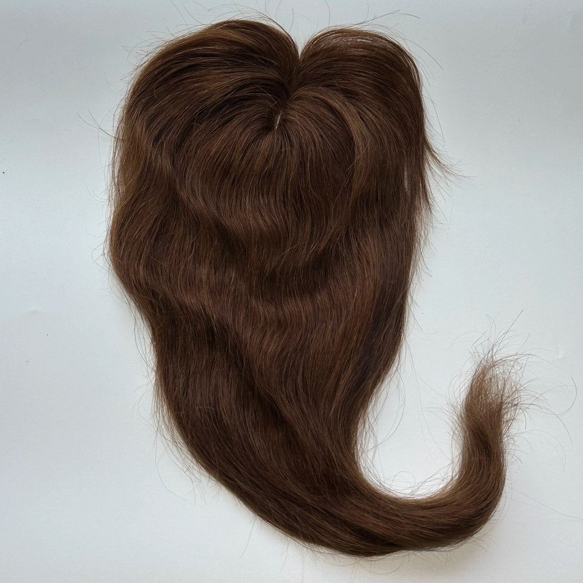 Straight human hair topper in colour 4, product top view